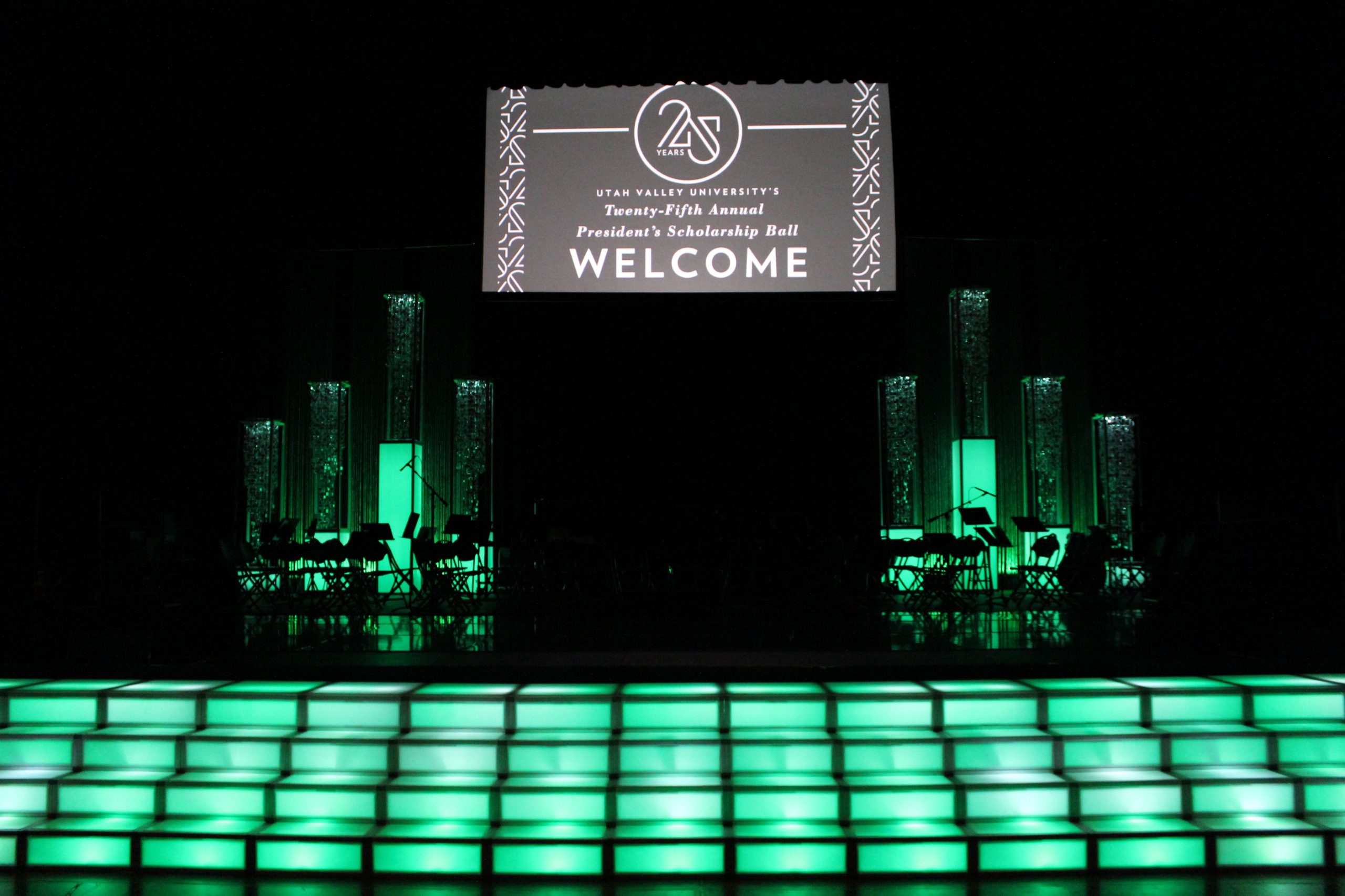 Illuminated LED stage stairs and glowing event backdrop at Utah Valley University’s President’s Scholarship Ball, designed by In The Event.