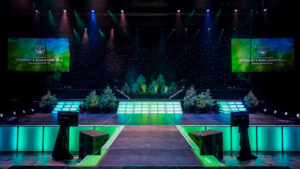 A stage featuring a forest backdrop.