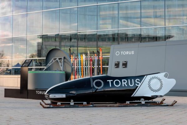 Event Production AV Services bobsled photo op and branded display for Torus at Utah Tech Week in Utah by In The Event
