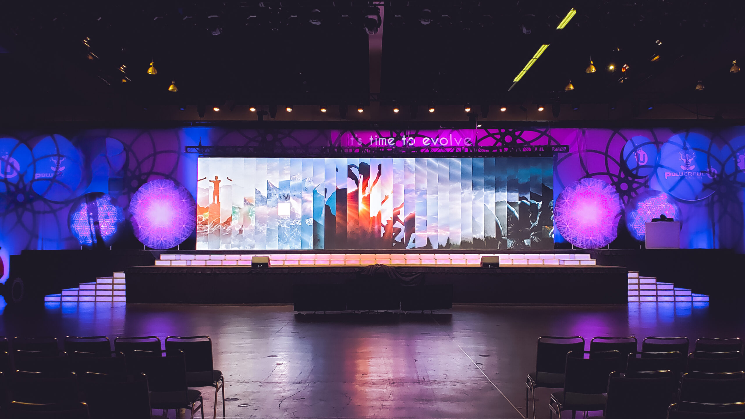 LED stage design featuring custom graphic backdrops and rentable LED steps.