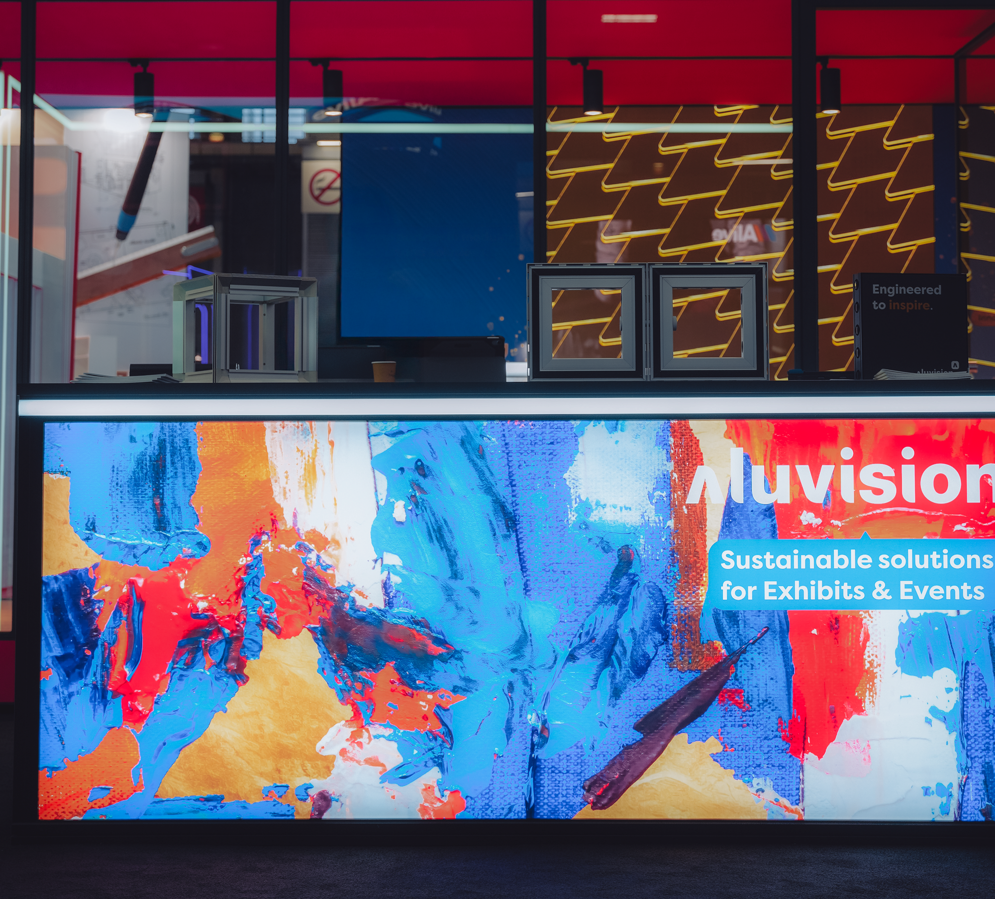 Aluvision video counter with custom digital graphics in primary colors for trade show booth.