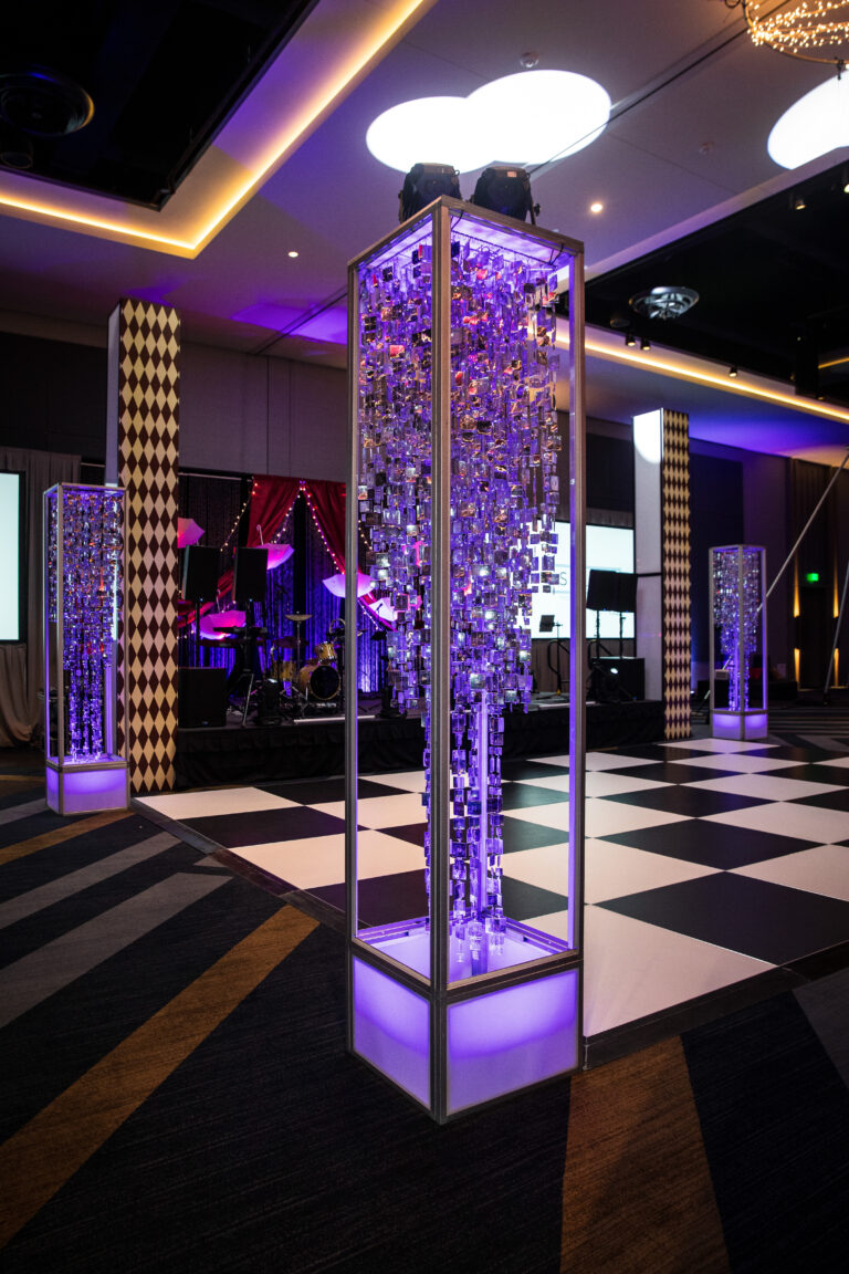 Close-up of crystal decor column with LED lighting beside a black and white dance floor at the SILAC Insurance Gala 2024