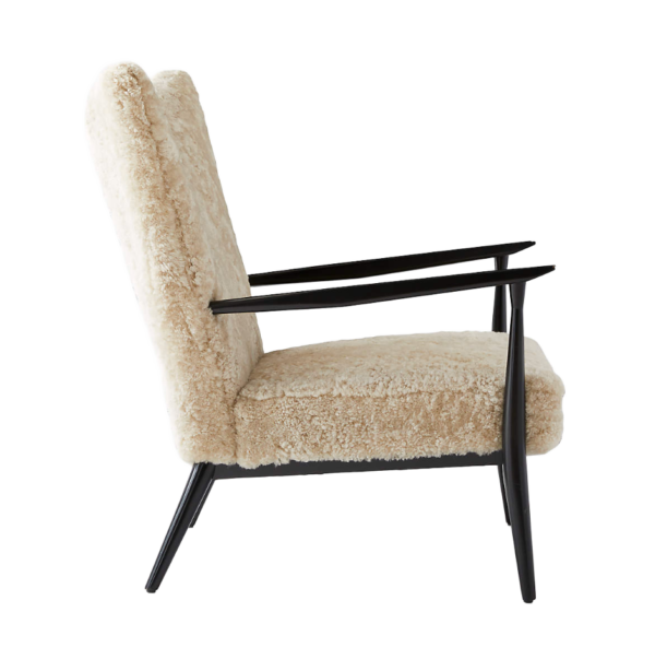 Marion Arm Chair with cream textured upholstery and black metal frame shown from the side highlighting armrest and seat depth