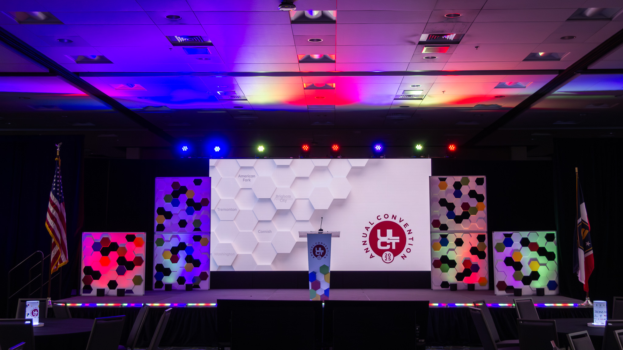 Trade show booth with mannequins and large branded wall graphics