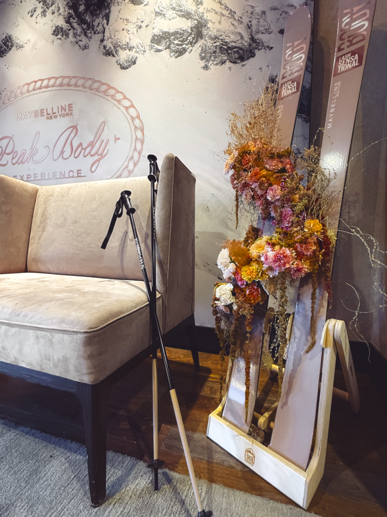 Event furniture, custom branded graphics, and floral styling for Maybelline New York Peak Body Experience at Blue Sky Lodge in Utah by In The Event