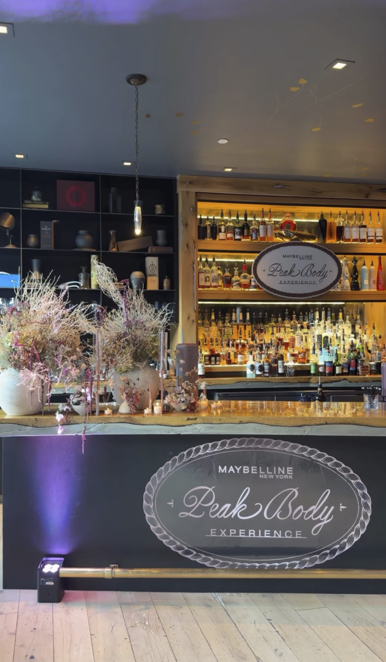 Custom branded bar front graphics and floral styling for Maybelline New York Peak Body Experience at Blue Sky Lodge in Utah by In The Event