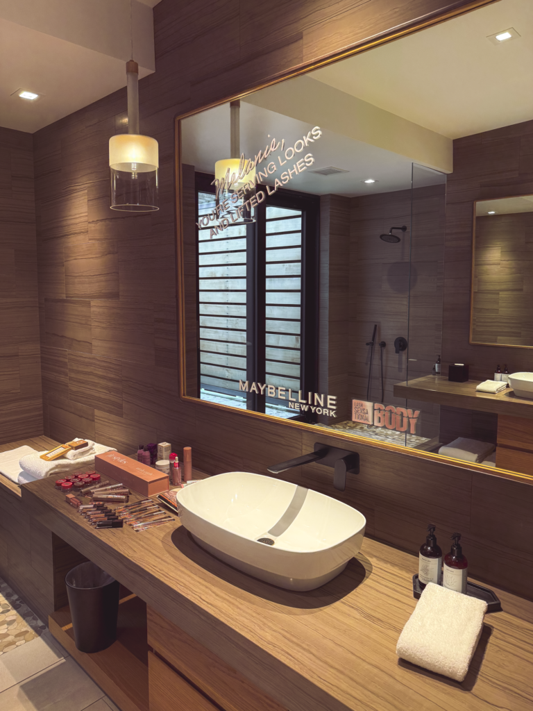 Custom mirror decals and branded graphics installation for Maybelline New York Peak Body Experience at Blue Sky Lodge in Utah by In The Event