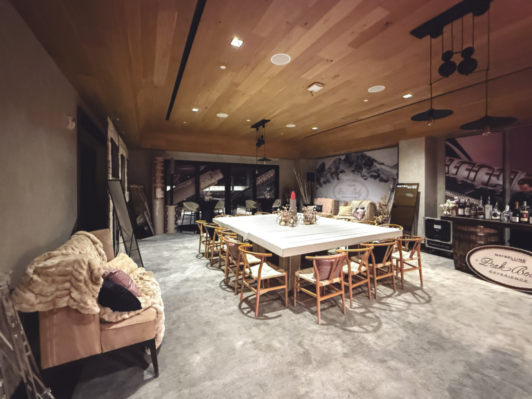 Event furniture, custom branded graphics, and layout design for Maybelline New York Peak Body Experience at Blue Sky Lodge in Utah by In The Event