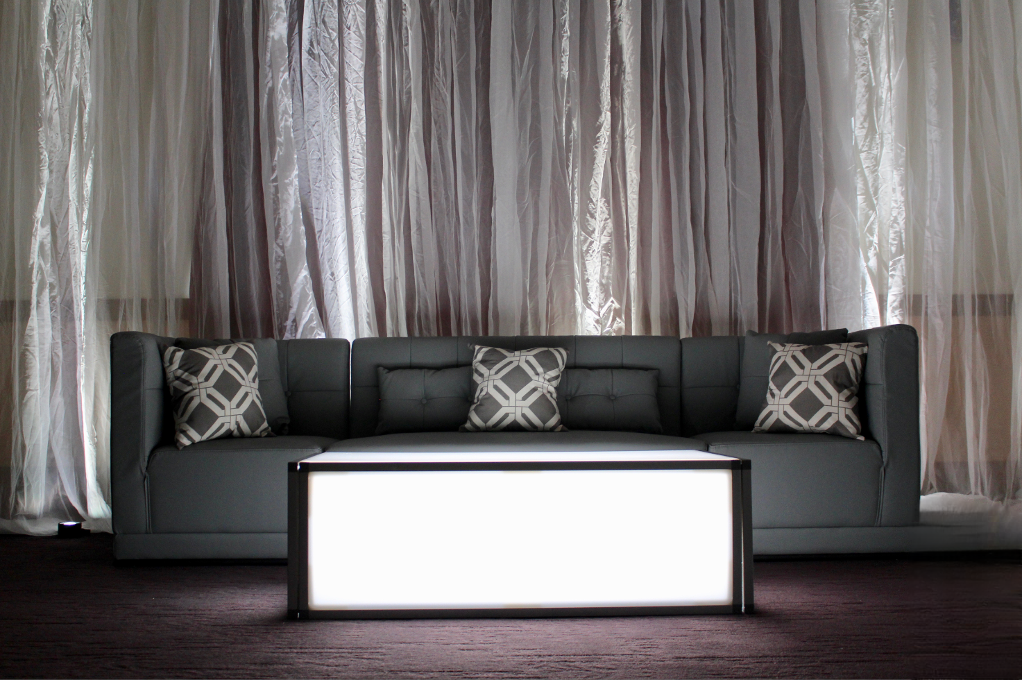 VIP lounge enclosed with black velour pipe and drape at event in Utah