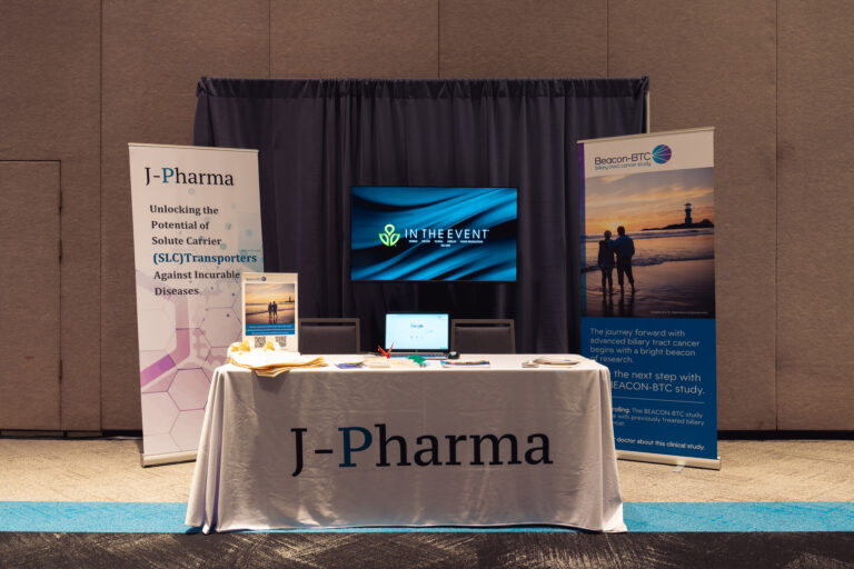 Branded exhibitor booth at the CCF 2026 Annual Conference at the Salt Palace Convention Center featuring sponsor banners, a display monitor, and informational materials for attendees.
