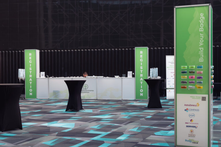 Conference registration area with illuminated registration towers, branded badge information display, and custom check-in counters at the CCF 2026 Annual Conference at the Salt Palace Convention Center.