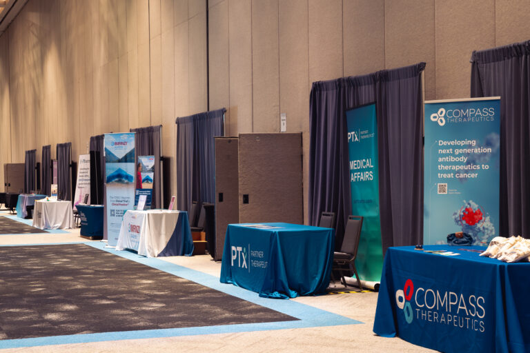 Exhibitor booths line the sponsor hallway at the CCF 2026 Annual Conference at the Salt Palace Convention Center, showcasing branded displays and informational exhibits for attendees.