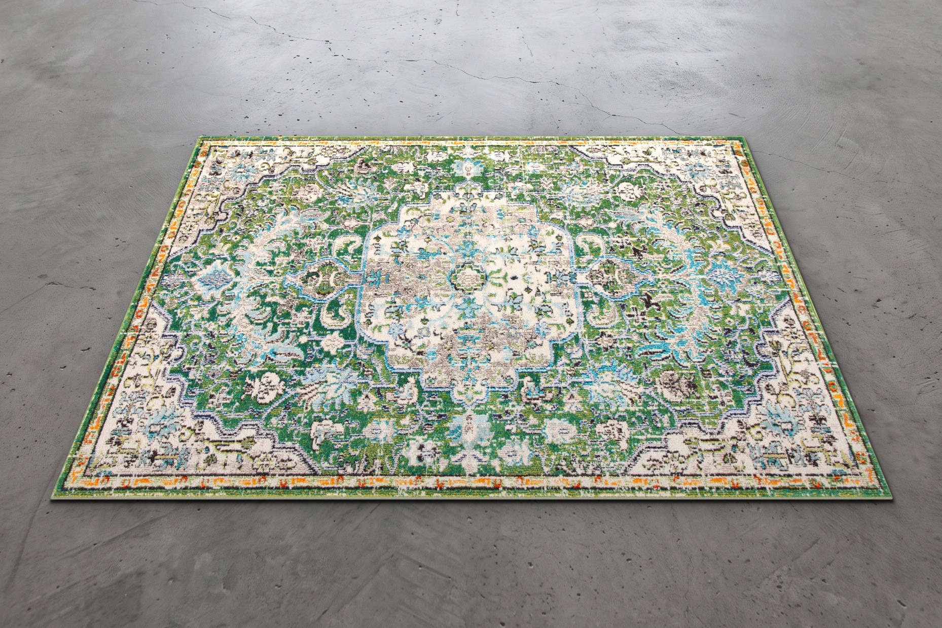 A 10x8 ft oriental green area rug with an intricate traditional medallion pattern, laid out on a polished gray concrete studio floor.